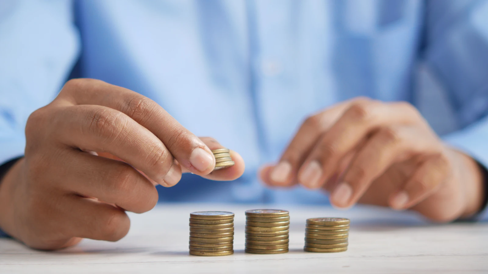Cash, coins and planning notes on a desk for finance planning