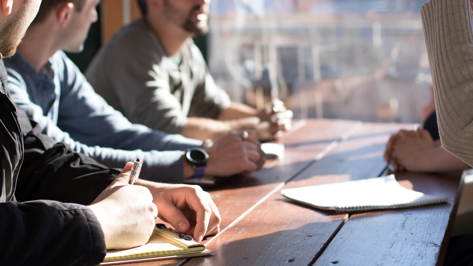 A team planning a project around a table during a meeting
