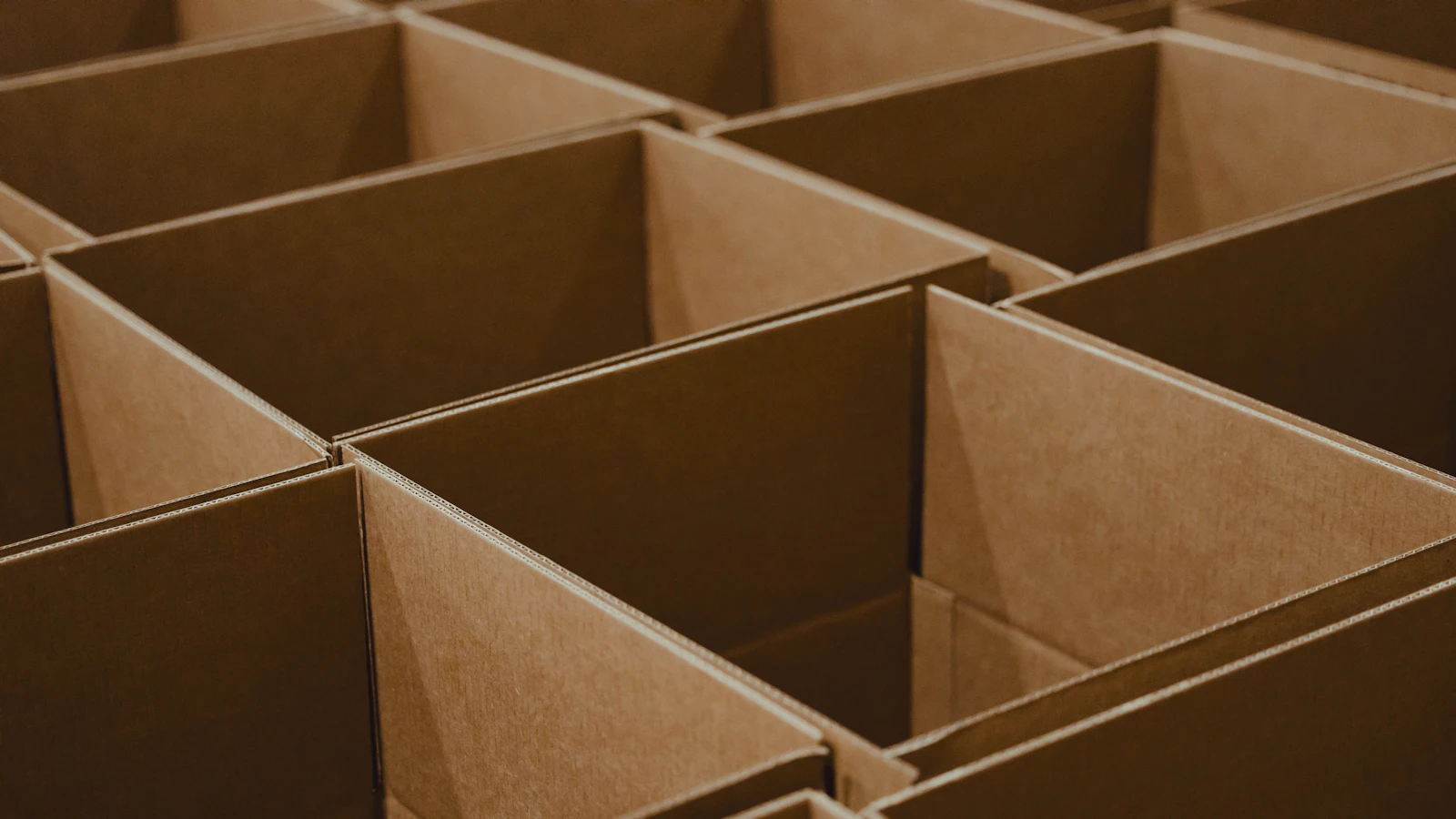 Organised boxes in a warehouse, representing inventory management methods